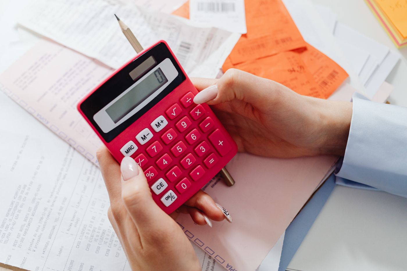 A calculator used alongside financial paperwork.